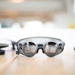 selective focus photography of gray glasses